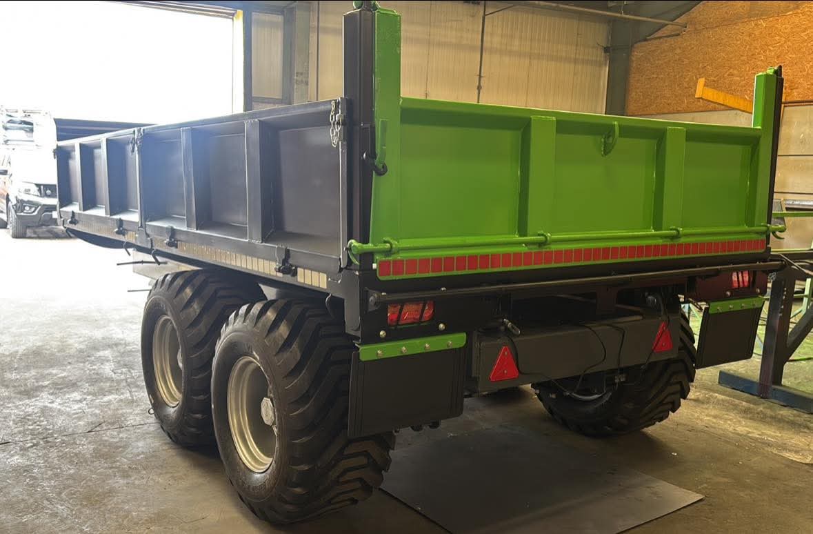 Green MT Plant dropside trailer with sides down in the workshop