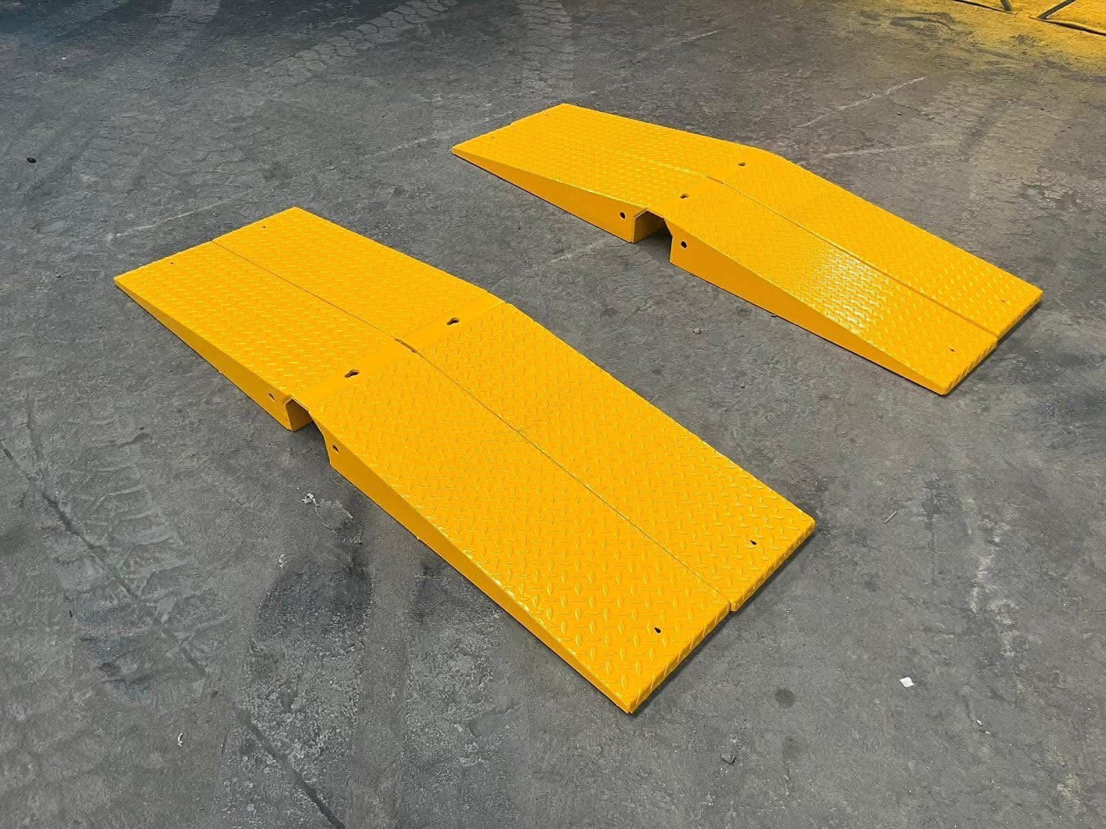 Pair of yellow MT Plant chequer-plate loading ramps
