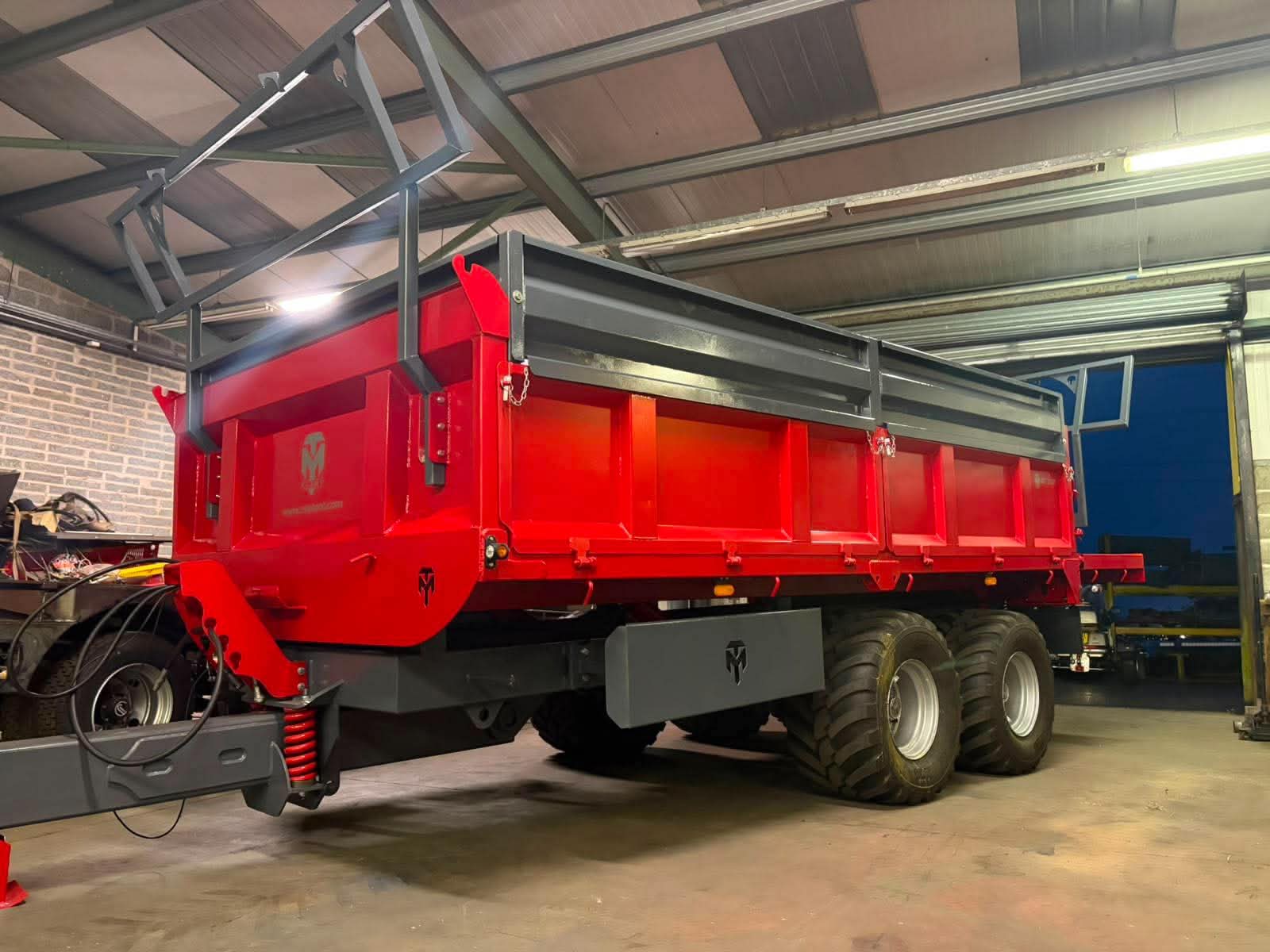 Red MT Plant 12T DST dropside trailer in the Banbridge workshop